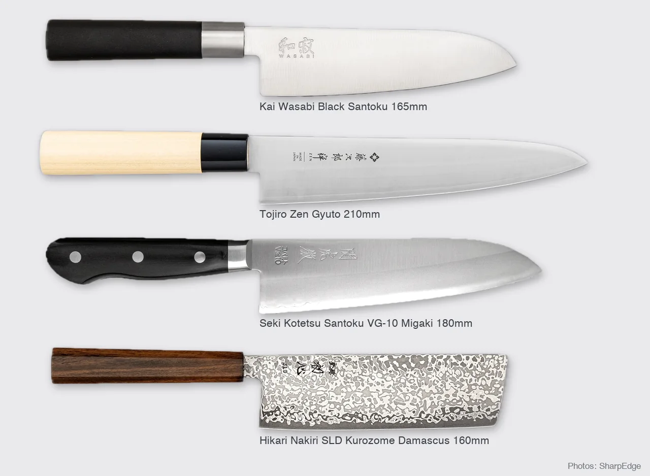 Four Japanese knives shown to scale: Kai Wasabi Black Santoku 165mm, Tojiro Zen Gyuto 210mm, Seki Kotetsu Santoku 180mm and Hikari Nakiri 160mm (photos: SharpEdge)