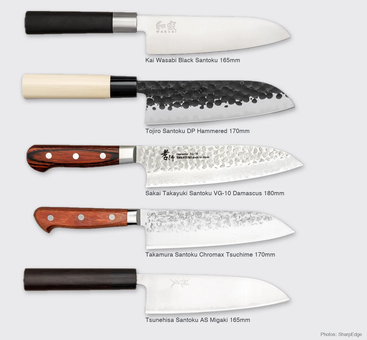 The five santoku knives in this guide shown to scale: Kai Wasabi Black, Tojiro DP Hammered, Sakai Takayuki VG-10 Damascus, Takamura Chromax Tsuchime and Tsunehisa AS Migaki