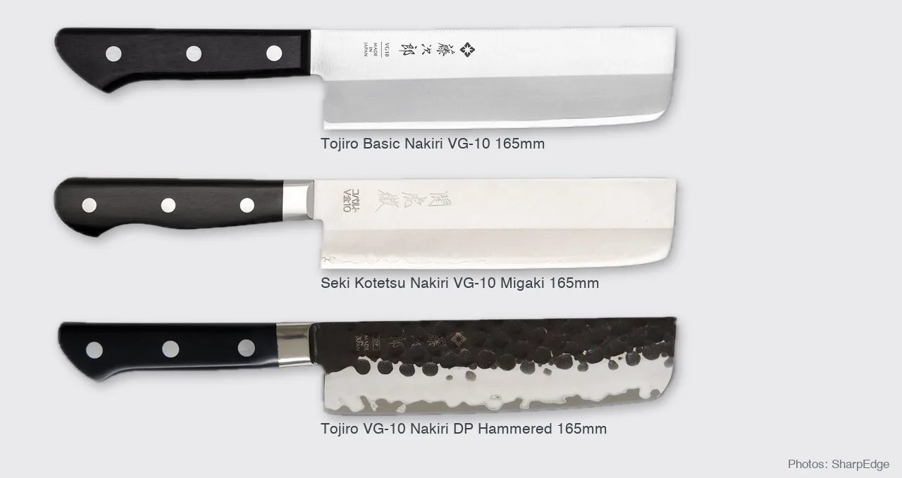 Three nakiri knives shown to scale: Tojiro Basic, Seki Kotetsu with a black pakkawood handle, and Tojiro DP Hammered with a dark hammered blade (photos: SharpEdge)